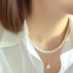 woman wearing pearl necklace